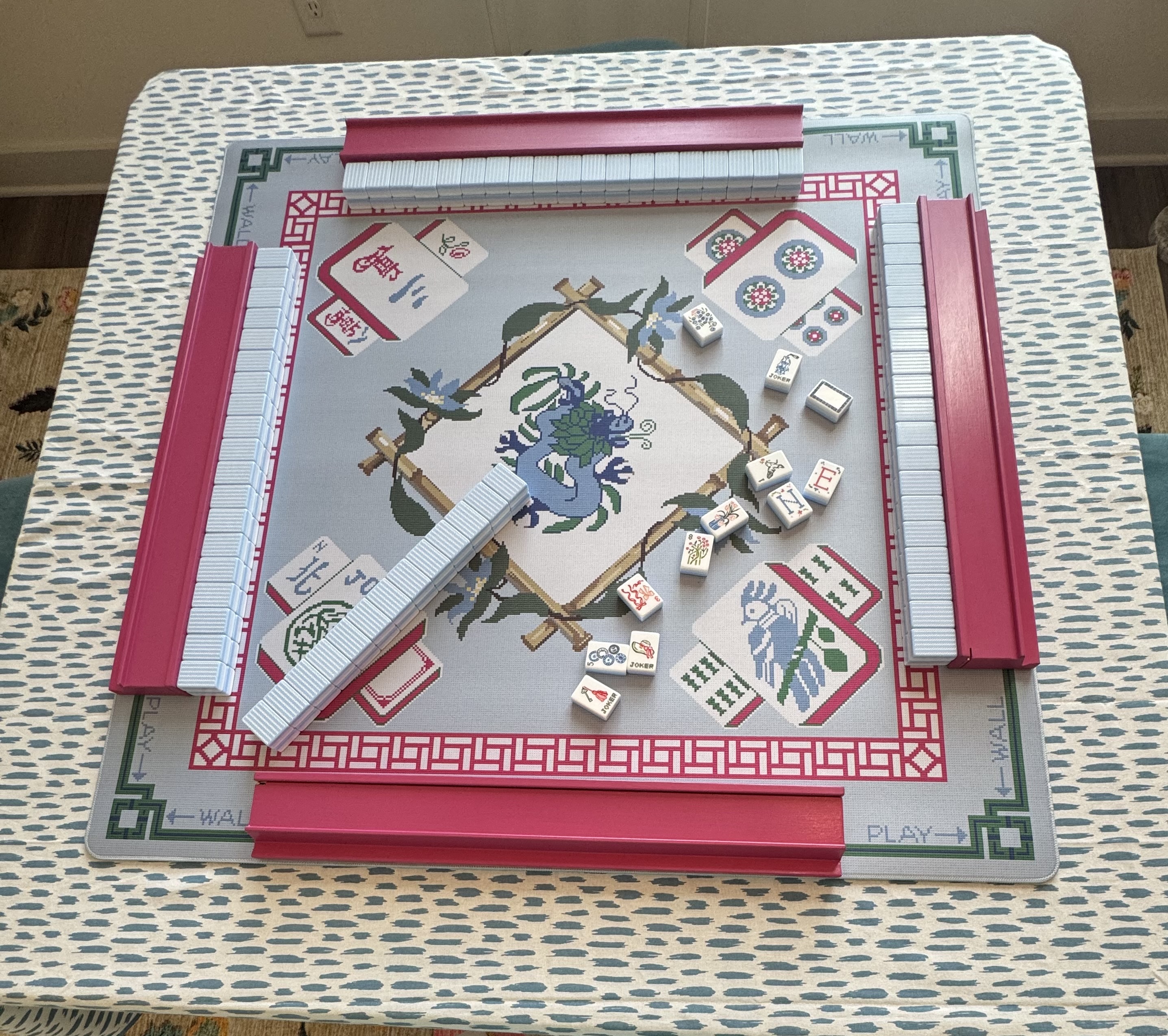 Miss Darling tiles, “Crossstitch” mat with hot pink racks